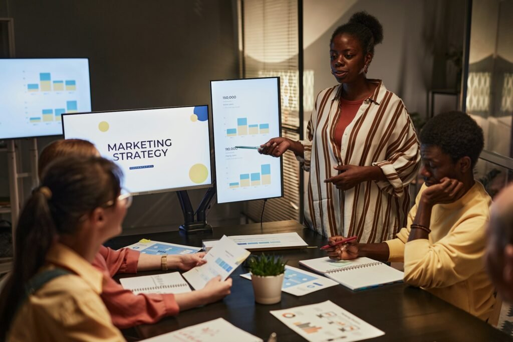 Black Woman Presenting Plan At Meeting